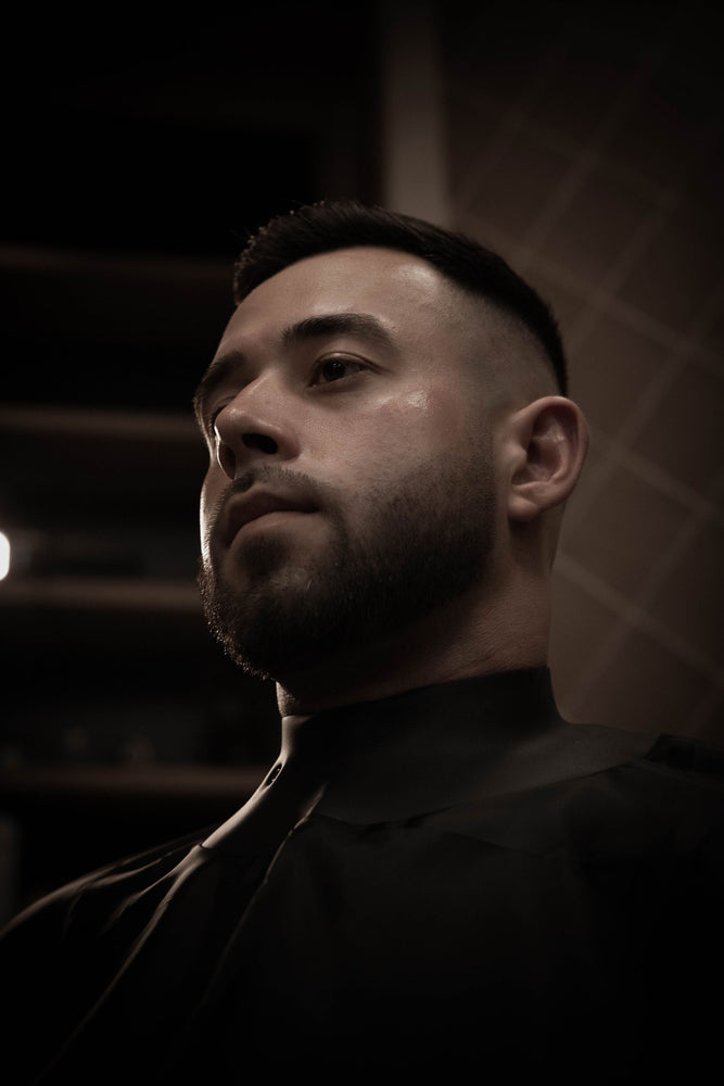 Executive gentleman receiving grooming service at Joe Vipond Dubai salon