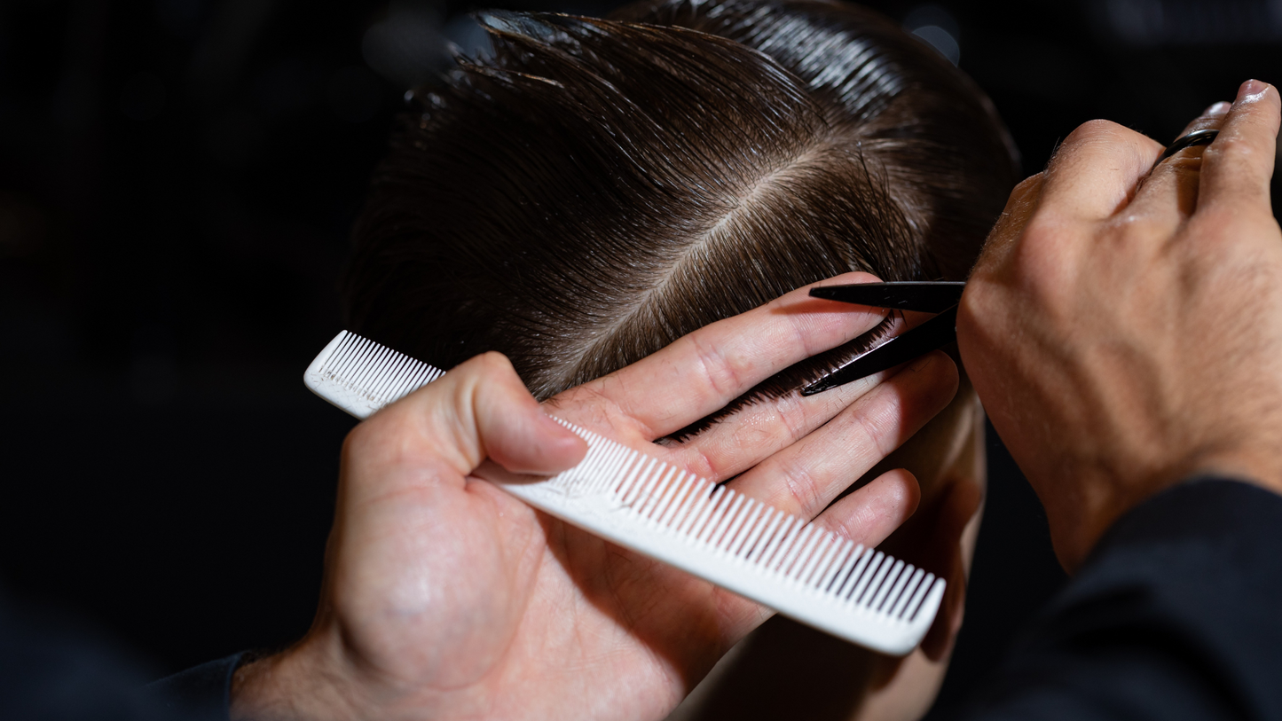 Gentleman receiving a precision haircut at Joe Vipond London salon